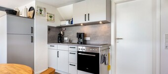 Apartamento vacacional 'Huus Achtern Diek' con terraza comunitaria y Wi-Fi
