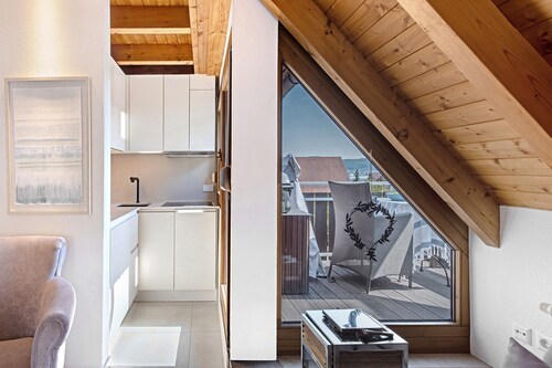 Above the Rooftops of Bodman – Your Stylish Home Away from Home with Lake View