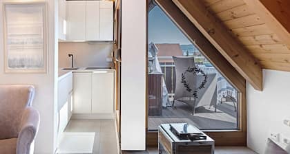 Above the Rooftops of Bodman – Your Stylish Home Away from Home with Lake View