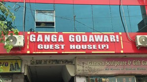 A building with a sign for 'Ganga Godawari Guest House (P)'. - Ganga Godawari Guest House (Varanasi)