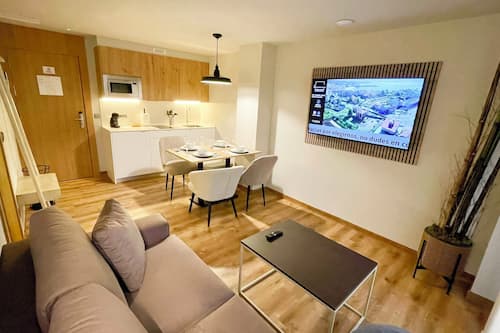 Family Apartment, Courtyard View | Living area | Flat-screen TV