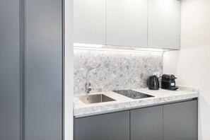 Fridge, microwave, stovetop, coffee/tea maker