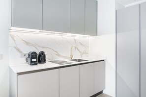 Fridge, microwave, stovetop, coffee/tea maker