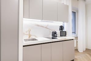 Fridge, microwave, stovetop, coffee/tea maker