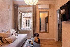 Comfort Apartment, City View | Living area | 110-cm Smart TV with digital channels