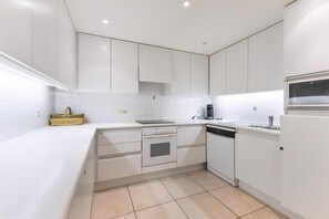 Oven, electric kettle, dining tables