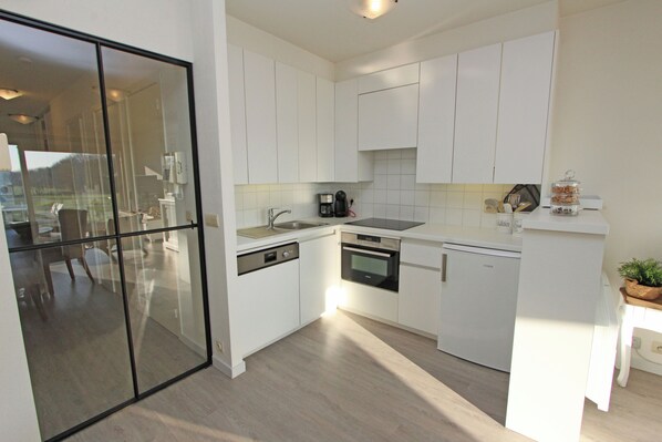 Microwave, oven, coffee/tea maker, cookware/dishes/utensils