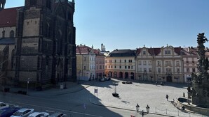 A historic square with a prominent church and classical buildings. - Penzion Tlustá kachna  (Chrudim)