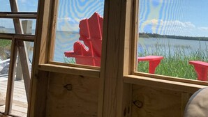 A wooden structure with a view of a lake and clouds. - The Westender Retreat | Amazing Lake Views & Waterfront Dock House (Hessel)