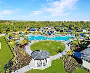 A resort with a large central pool, multiple smaller pools, and a gazebo.