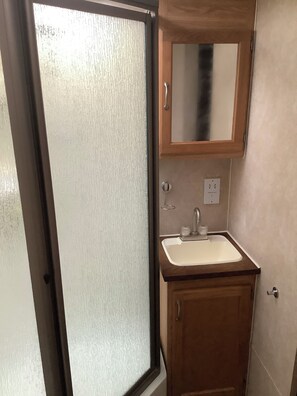 Shower, hair dryer, towels, soap