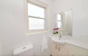 Shower, hair dryer - Ocean views, Light-filled Bondi Beach Apartment (Bondi)