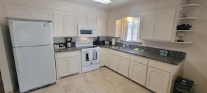 Condo, 2 Bedrooms | Private kitchen | Fridge, oven, coffee/tea maker, toaster