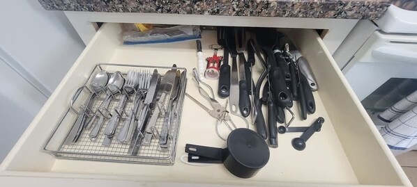 A kitchen drawer with utensils and cookware. - Campeche Retreat #12 2 Bedroom Condo (South Padre Island)