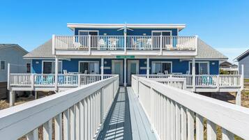 A two-story building with a balcony and a sign that reads "SPARRY SHACK".