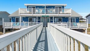 A two-story building with a balcony and a sign that reads "SPARRY SHACK". - Shady Shack West a 3 BR Oceanfront Duplex with Unobstructed Ocean Views (Emerald Isle)