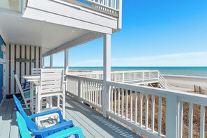 A wooden deck with white railings overlooking a beach. - Shady Shack West a 3 BR Oceanfront Duplex with Unobstructed Ocean Views (Emerald Isle)