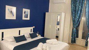 Deluxe Triple Room, Balcony | 1 bedroom, in-room safe, desk, blackout drapes