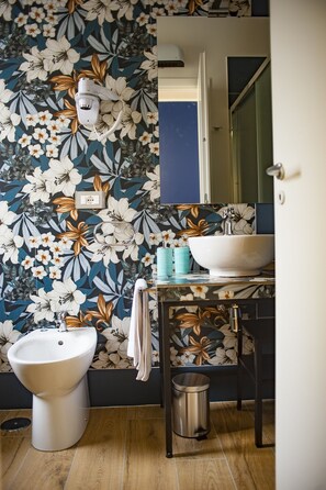 Deluxe Triple Room, Balcony | Bathroom | Shower, hair dryer, towels, soap
