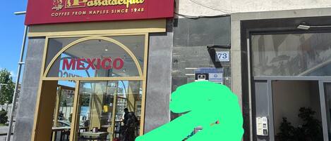 A coffee shop named 'Passalacqua' with a sign that reads 'Coffee from Naples since 1948.'