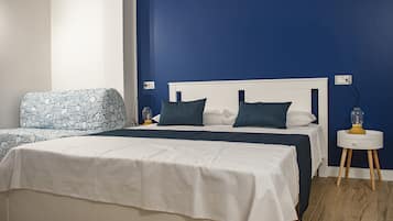 Deluxe Triple Room, Balcony | In-room safe, desk, blackout drapes, free WiFi