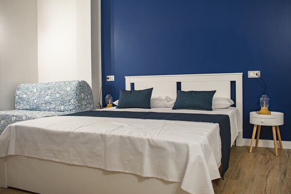 Deluxe Triple Room, Balcony | 1 bedroom, in-room safe, desk, blackout drapes