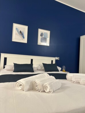 Deluxe Triple Room, Balcony | 1 bedroom, in-room safe, desk, blackout drapes