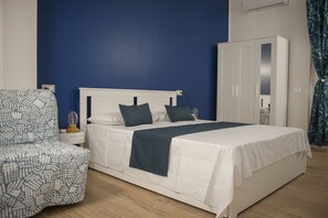 Deluxe Triple Room, Balcony | 1 bedroom, in-room safe, desk, blackout drapes