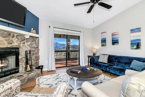 Signature Cabin, 2 Bedrooms, Patio, Mountain View | Living room | 50-inch Smart TV with digital channels, fireplace, foosball - Dee's Cozy Cottage (Waynesville)