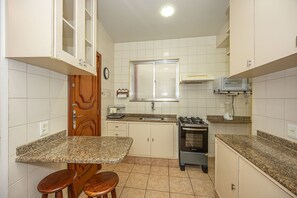 Fridge, oven, coffee/tea maker, cookware/dishes/utensils