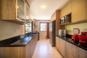 Microwave, oven, coffee/tea maker, cookware/dishes/utensils