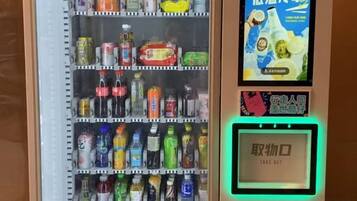 A vending machine with various beverages and snacks.