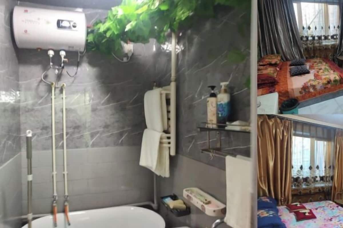 Un baño con ducha, inodoro, lavamanos y un perchero para toallas.