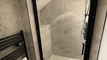 Shower, hair dryer, towels, toilet paper
