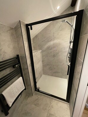 Shower, hair dryer, towels, toilet paper