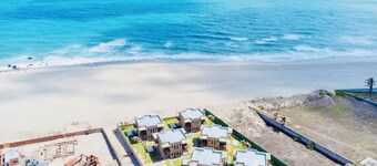 Beachfront fully-equipped 2-bedroom house near Beach Park with AC, WiFi.