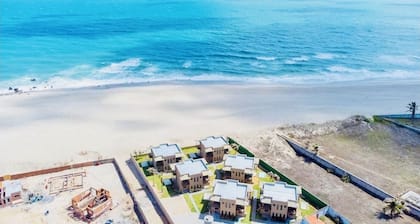 Beachfront fully-equipped 2-bedroom house near Beach Park with AC, WiFi.