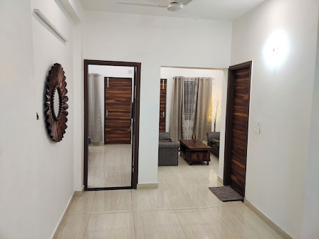 Interior. Emeralds – Modern, Spacious 2 BHK Flat with AC & WiFi ~ Near Lake & Golf Course
