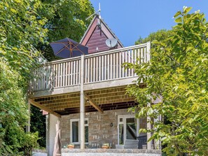 A two-story house with a balcony, stone walls, and a satellite dish. - Valley Lodge - UK49228 (Gunnislake)