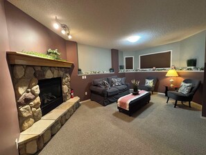 Smart TV, fireplace - Stay heavenly. Stay cozy. Stay with us in Airdrie. (Airdrie)