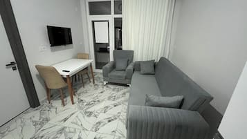 独特公寓, 1 间卧室, 阳台, 城市景观 | 起居区 | 40-英寸纯平电视(配备卫星频道)