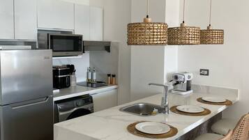 Fridge, microwave, stovetop, coffee/tea maker