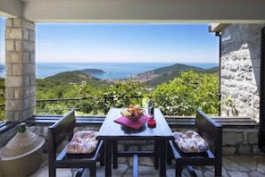 Outdoor dining - Breathtaking Hilltop Villa with Pool and Stunning Sea View in Montenegro (Lapcici)