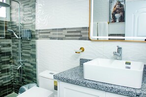 Shower, hair dryer, towels, soap