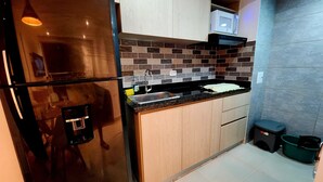 A modern kitchen with a stainless steel refrigerator, a microwave, and a sink. - New and with ocean view (Cartagena)