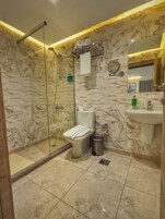 Shower, hydromassage showerhead, eco-friendly toiletries, hair dryer