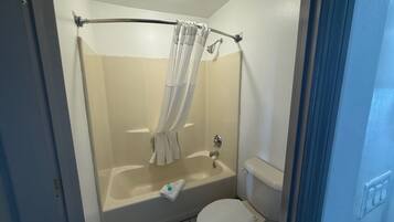 Separate tub and shower, towels, soap, shampoo