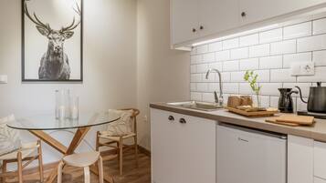 Fridge, stovetop, electric kettle, cookware/dishes/utensils