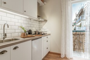 Fridge, stovetop, electric kettle, cookware/dishes/utensils