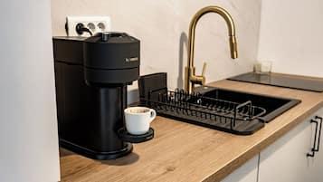 Microwave, stovetop, coffee/tea maker, cookware/dishes/utensils